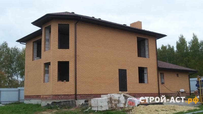 Построить дом в Кашире двухэтажный с гаражом из блоков с облицовкой из кирпича монолитные перекрытия и мягкая черепица Тегола Нордик